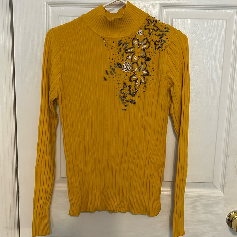 Yellow turtle neck, long sleeve and beaded design. Size S